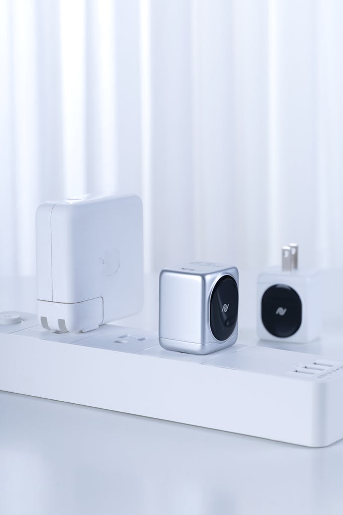 Sleek design of chargers and adapter cubes on a power strip against a white background.