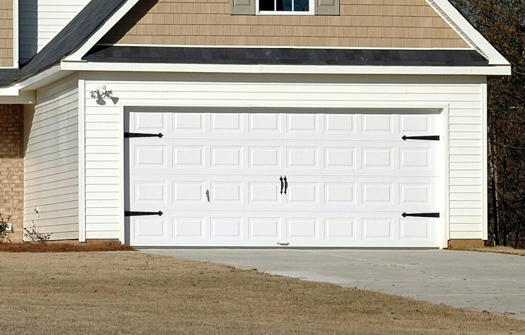 Elegant two-storey house with garage, showcasing modern architecture and residential charm.